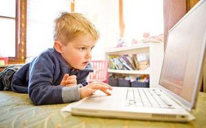 Young boy learning on computer